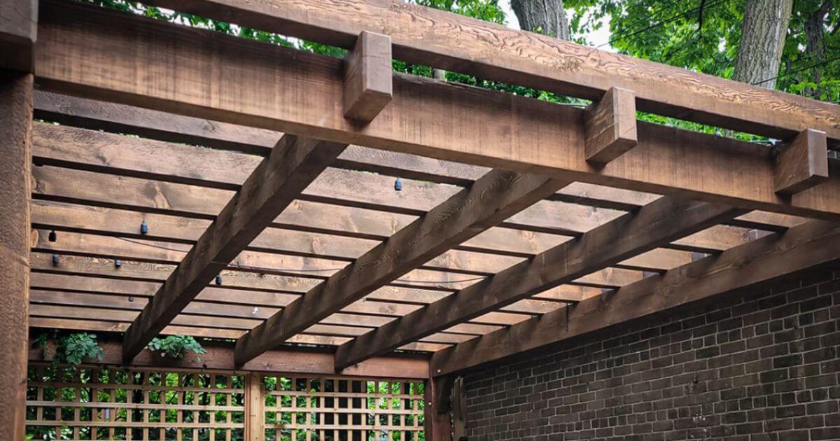 Custom wooden pergola with overhead beams.